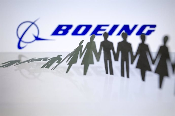 11 October 2024, Paraguay, Asuncion: Boeing logo is displayed behind cut out paper figures chain. Photo: Andre M. Chang/ZUMA Press Wire/dpa