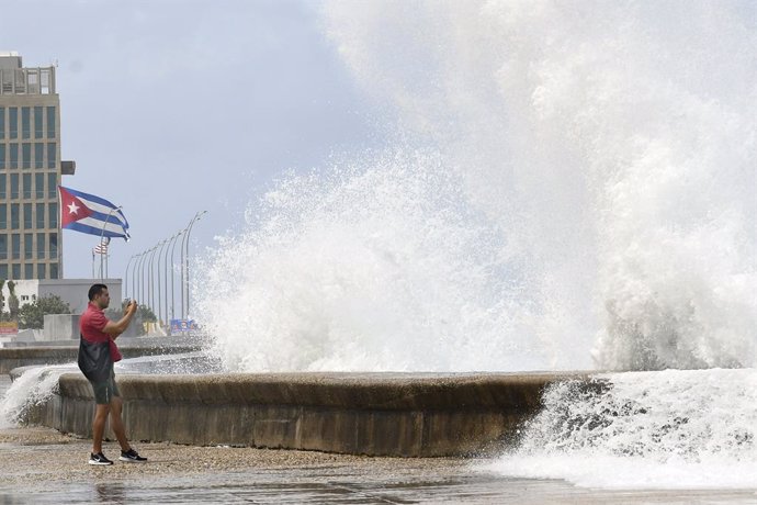 BEIJING, Oct. 11, 2024  -- Huge waves are seen along a seaside road in Havana, Cuba, Oct. 9, 2024. Hurricane Milton brought intermittent rainfall to Cuba.