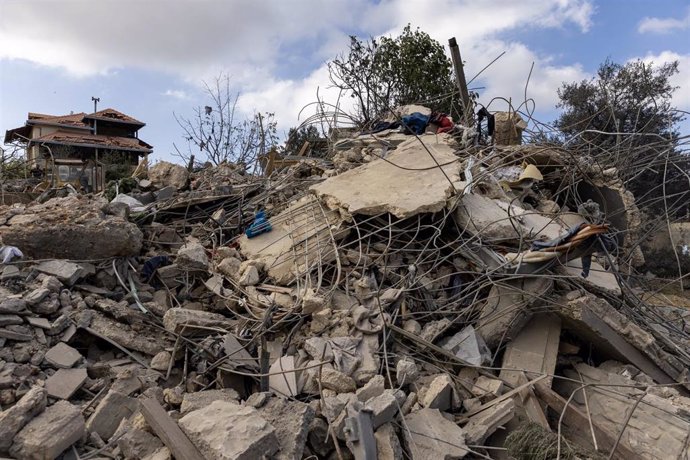 October 15, 2024, Aitou, Lebanon: Clothes hang on rebar above the rubble after an Israeli attack leveled a residential building housing displaced people on October 15, 2024 in Aitou, Lebanon. The Lebanese Red Cross medics continued collecting pieces of bo