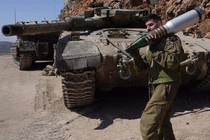 ISREAL-LEBANON BORDER, Oct. 7, 2024  -- An Israeli reserve soldier is seen at a tank staging area near northern Israeli border with Lebanon, on Oct. 7, 2024. Israel's military has declared four additional towns near the Lebanon border as a "closed militar