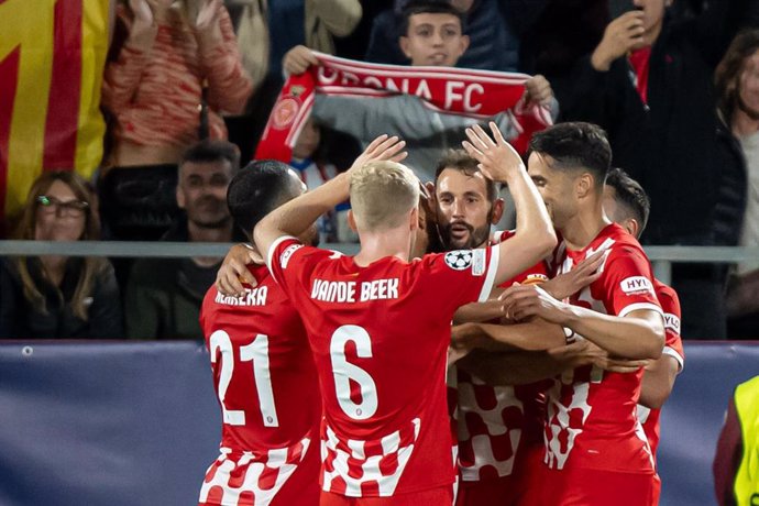 Girona FC's Miguel Gutierrez celebrates after scoring his side's first goal with teammates, during the UEFA Champions League soccer match between Girona FC and Slovan Bratislava at Municipal de Montilivi Stadium