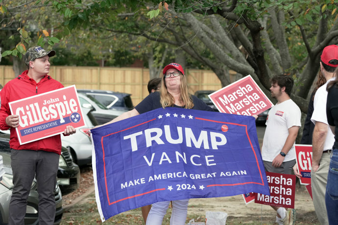 November 5, 2024, Memphis, Tennessee, USA: A Trump supporter campaigns for candidate Former President Trump at Second Baptist Church on election day.