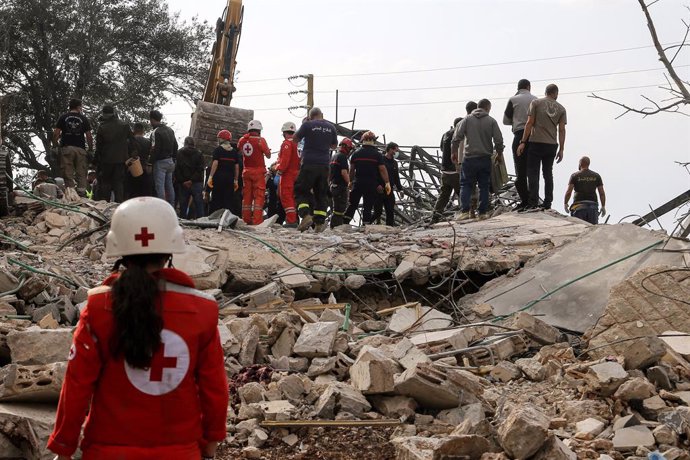 November 10, 2024, Almat, Almat, Lebanon: Lebanese Red Cross and Civil defense personnel gather at the site of a house that was destroyed in an Israeli air strike in the village of Almat, north of Beirut. At least 23 people, including seven children were 