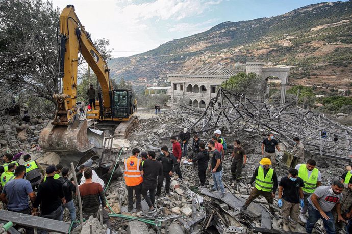 November 10, 2024, Almat, Almat, Lebanon: Lebanese civil defense workers bring blankets to cover a body of a child they found among the rubble of a house that was destroyed in an Israeli air strike in the village of Almat, north of Beirut. At least 23 peo