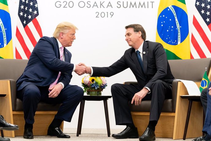 Archivo - Imagen de archivo de Donald Trump y Jair Bolsonaro, en la cumbre del G20 de 2019, en Osaka, Japón.