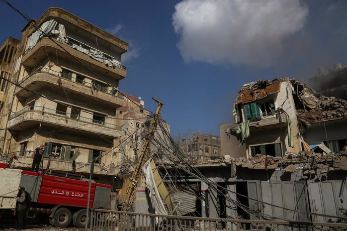 November 13, 2024, Beirut, Beirut, Lebanon: A fire fighter prepares to douse fire amid destruction caused by an Israeli air strike in the area of Shiah on the edge of Beirut southern suburb. The Israeli military pounded Beirut's southern suburbs with airs