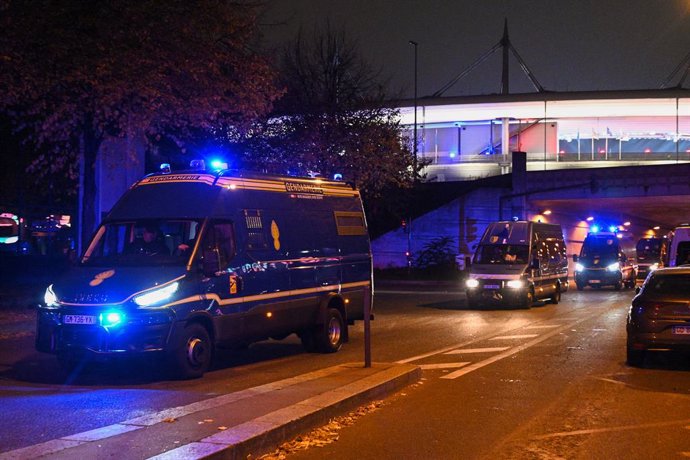 SAINT-DENIS, Nov. 15, 2024  -- French police vehicles guard around the Stade de France before the UEFA Nations League League A football match between France and Israel at the Stade de France stadium in Saint-Denis, near Paris, France, Nov. 14, 2024.