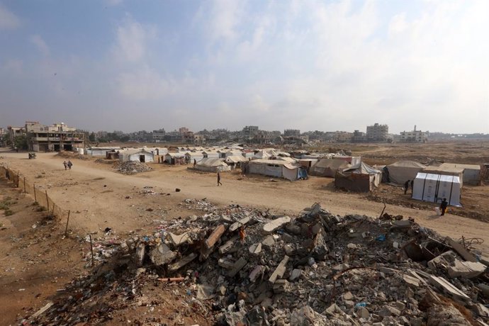 November 10, 2024, Al-Bureij, Gaza Strip, Palestinian Territory: Displaced Palestinians who fled Israeli army operations, gather with their belongings in front of newly set up tents in makeshift tents as Palestinians in the Bureij Refugee Camp, located in