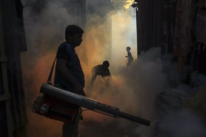 November 15, 2024, Dhaka, Dhaka, Bangladesh: A worker sprays pesticide to kill mosquitoes at a slum in the capital city of Dhaka, Bangladesh. Last year, the country recorded 1,705 dengue-related deaths and 321,179 dengue cases.