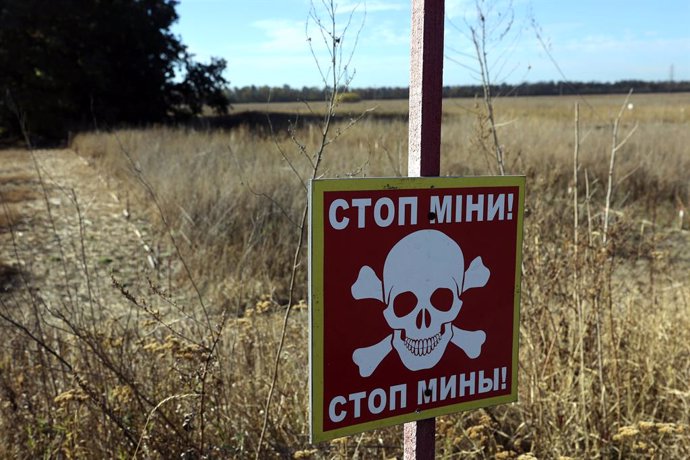 October 23, 2024, Kharkiv Region, Ukraine: KHARKIV REGION, UKRAINE - OCTOBER 23, 2024 - The warning sign "Stop! Mines" is seen in the area where demining was carried out using the latest remote control and soil survey equipment, Kharkiv region, eastern Uk