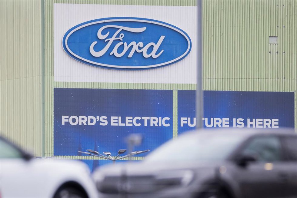 20 November 2024, No, Cologne: Ford Explorer electric cars are parked on car transporters on the Ford factory premises. The US car manufacturer Ford wants to cut 2,900 jobs in Germany by the end of 2027 in order to reduce costs. Photo: Rolf Vennenbernd/