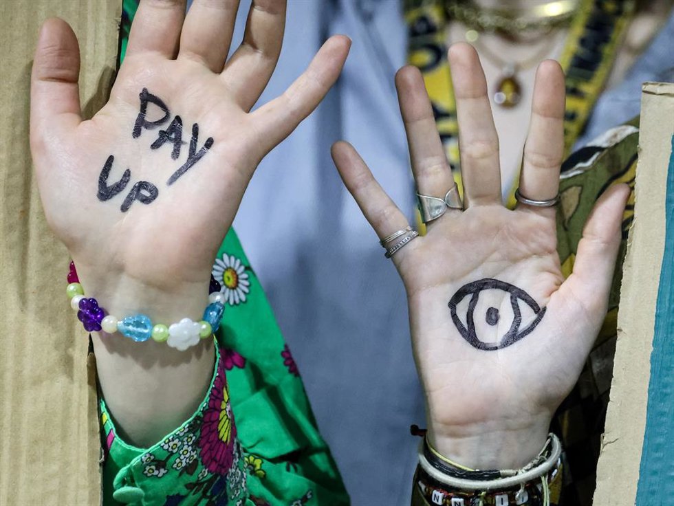 November 22, 2024, Baku, Azerbaijan: Activists show their hands as they stage a protest during a press conference in Blue Zone during United Nations Climate Change Conference COP29, an event held by United Nations Framework Convention on Climate Change