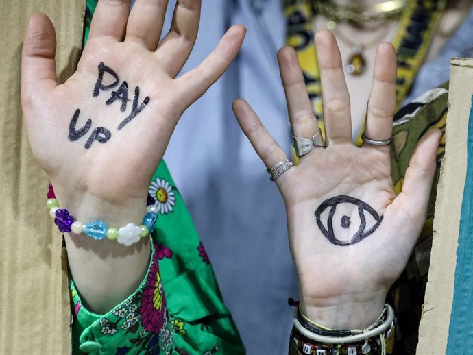 November 22, 2024, Baku, Azerbaijan: Activists show their hands as they stage a protest during a press conference in Blue Zone during United Nations Climate Change Conference COP29, an event held by United Nations Framework Convention on Climate Change (U