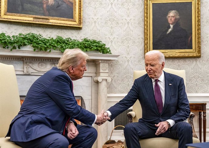 November 13, 2024, Washington, District Of Columbia, USA: United States President Joe Biden, right, shakes hands with US President-elect Donald J Trump during a meeting in the Oval Office of the White House in Washington. Biden will argue in favor of cont