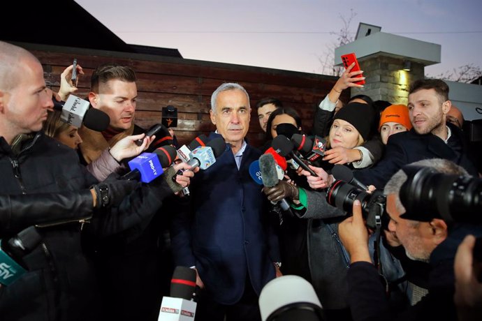 IZVORANI (ROMANIA), Nov. 26, 2024  -- Independent candidate Calin Georgescu (C) speaks to the media in front of his residence in Izvorani village, near Bucharest, Romania, on Nov. 26, 2024. Independent candidate Calin Georgescu and Elena Lasconi, leader o