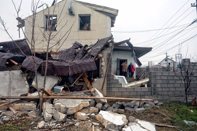 November 28, 2024, Odesa, Odesa Region, Ukraine: ODESA REGION, UKRAINE - NOVEMBER 28, 2024 - People are seen on the porch of the house damaged by a Russian missile strike, Odesa region, southern Ukraine