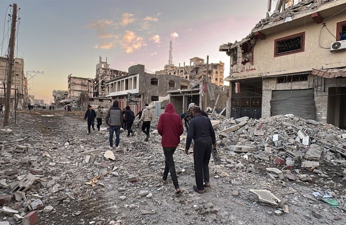 November 29, 2024, Nuseirat, Gaza Strip, Palestinian Territory: Palestinians inspect the destruction of homes and streets after an Israeli military attack on the Nuseirat refugee camp, central Gaza Strip, amid the ongoing conflict between Israel and Hamas