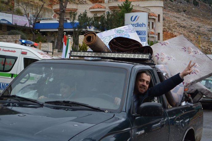 BEKAA, Nov. 28, 2024  -- A displaced man gestures while driving on his way home in the Bekaa region, Lebanon, on Nov. 27, 2024. Calm prevails over the border areas in southern Lebanon on Wednesday as a ceasefire between Israel and Lebanon took effect at 4