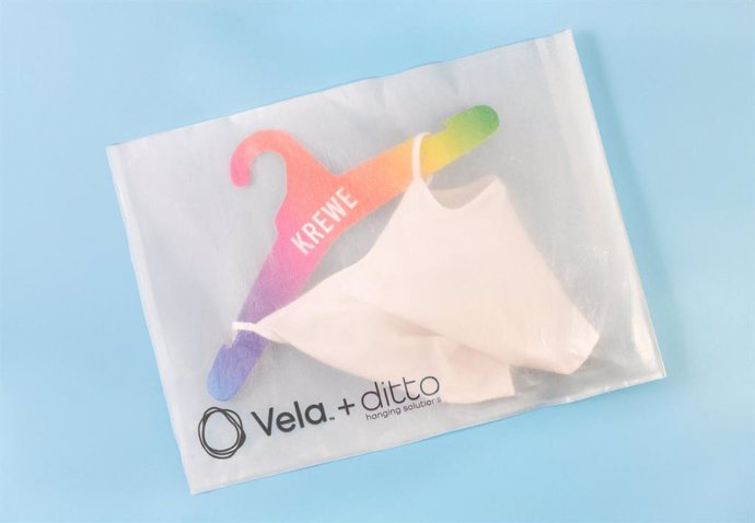 Vela, an award-winning alternative to single-use plastic. Here, a Vela bag is paired with a paper fiberboard hanger from Ditto Hanging Solutions, a subsidiary of Nexgen Packaging.