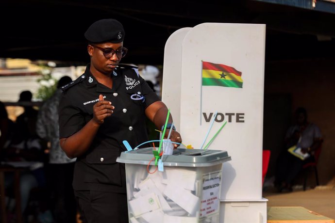 December 2, 2024, Accra, Greater Accra Region, Ghana: A police officer casts her ballot on special voting day ahead of the December 7, election.