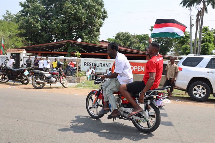 ACCRA, Dec. 9, 2024  -- Supporters of John Dramani Mahama celebrate after his winning in the presidential election in Accra, Ghana, Dec. 8, 2024.   John Dramani Mahama, who leads the opposition National Democratic Congress, announced his win on Sunday on 