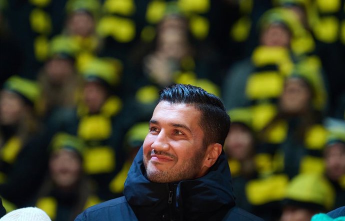 08 December 2024, North Rhine-Westphalia, Dortmund: Dortmund coach Nuri Sahin stands on the stage as Christmas carol singing perform at the Signal Iduna Park with 70,000 visitors. This is the sixth time that Borussia Dortmund has hosted Christmas carol 