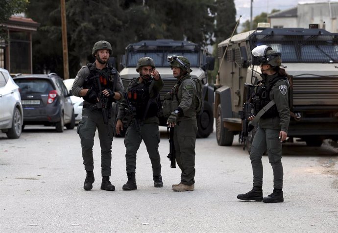 NABLUS, Nov. 30, 2024  -- Israeli soldiers surround the house of Samer Mohammed Ahmed Hussein in the village of Einabus, south of Nablus city in northern West Bank, Nov. 29, 2024.   Al-Qassam Brigades, the armed wing of Hamas, on Friday claimed responsibi