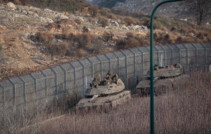 GOLAN HEIGHTS, Dec. 11, 2024  -- Israeli troops are seen near the buffer zone fence on the eastern side of the Golan Heights, on Dec. 10, 2024.   Israeli Defense Minister Israel Katz said on Tuesday that Israel was creating a "sterile defense zone" in sou