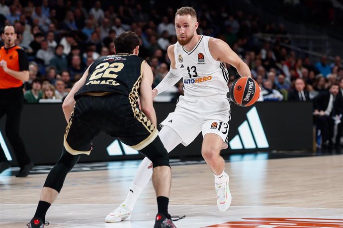 Terry Tarpey of AS Monaco and Dzanan Musa of Real Madrid in action during the Turkish Airlines EuroLeague Regular Season match between Real Madrid and AS Monaco at Wizink Center on December 19, 2024 in Madrid, Spain.