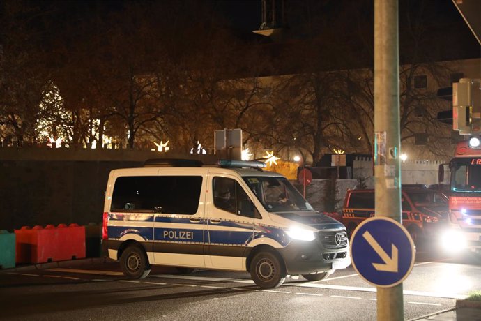 MAGDEBURG, Dec. 21, 2024  -- This photo shows a police vehicle near a Christmas market where a car rammed into a crowd in Magdeburg, Germany, Dec. 21, 2024.   A car plowed through a Christmas market in the central German city of Magdeburg on Friday evenin