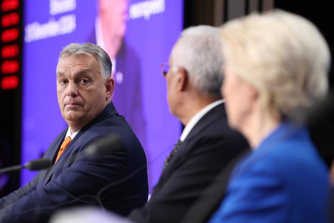 BRUSSELS, Dec. 20, 2024  -- Hungarian Prime Minister Viktor Orban (L) attends a press conference after a European Council summit in Brussels, Belgium, Dec. 19, 2024.