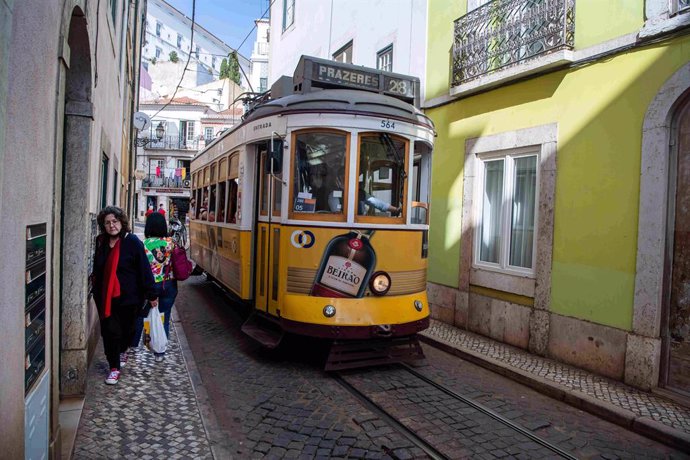 Archivo - April 29, 2022, Lisbon, Portugal: A tram is seen traveling through the streets of the Santa Apolonia district in Lisbon. Cases of covid-19 decreased in Portugal after a week of a slight increase. The number of new cases of the virus and the inci