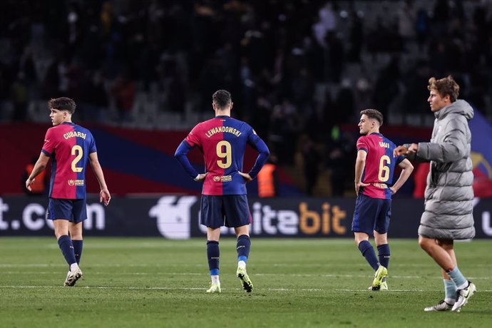 Robert Lewandowski, Pau Cubarsi and Pablo Martin Gavira Gavi of FC Barcelona laments during the Spanish league, La Liga EA Sports, football match played between FC Barcelona and Atletico de Madrid at Estadio Olimpico de Montjuic on December 21, 2024 in Ba