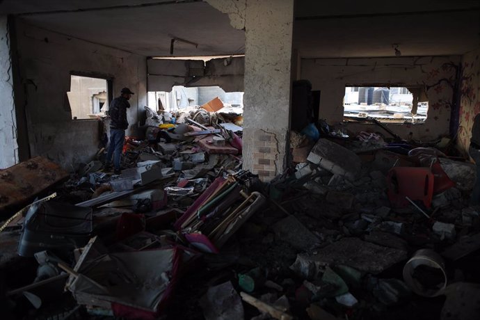 GAZA, Dec. 25, 2024  -- A Palestinian man is seen at the site of a building destroyed in Israeli bombardment in Deir al-Balah, central Gaza Strip, on Dec. 25, 2024. At least 22 Palestinians were killed in Israeli airstrikes across the Gaza Strip on Wednes