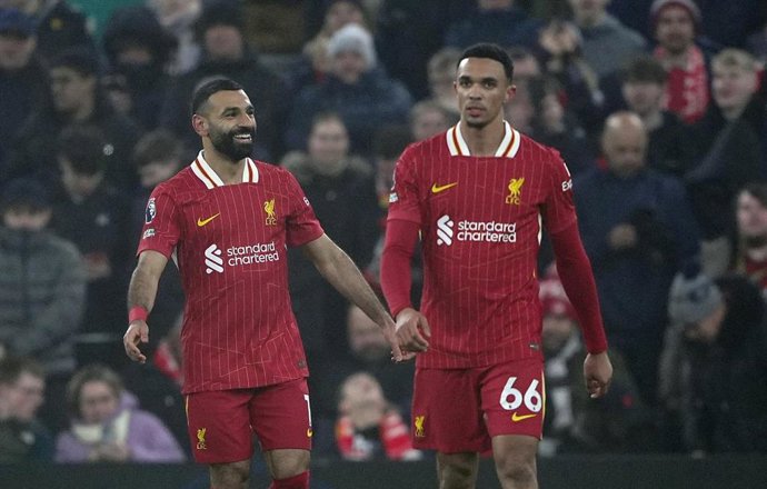 26 December 2024, United Kingdom, Liverpool: Liverpool's Mohamed Salah (L) celebrates scoring his side's third goal with teammate Trent Alexander-Arnold during the English Premier League soccer match between Liverpool and Leicester City at Anfield. Photo: