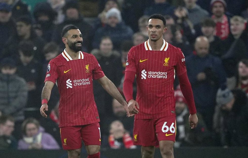 26 December 2024, United Kingdom, Liverpool: Liverpool's Mohamed Salah (L) celebrates scoring his side's third goal with teammate Trent Alexander-Arnold during the English Premier League soccer match between Liverpool and Leicester City at Anfield. Phot