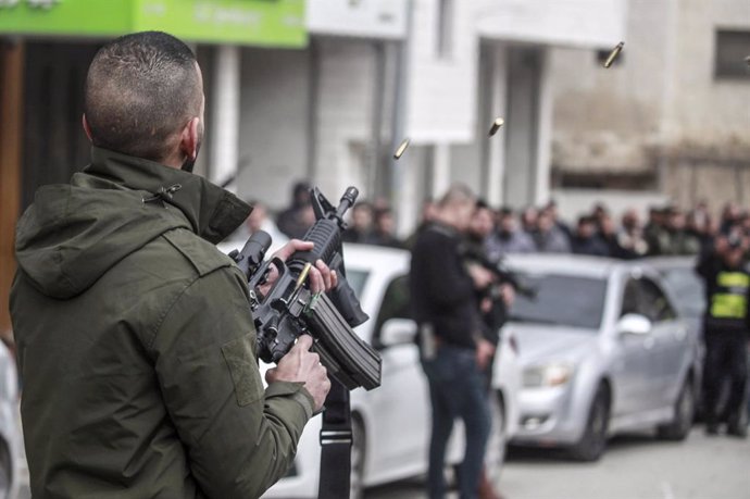 December 27, 2024, Nablus, West Bank, Palestine: A member of the Palestinian security forces fires into the air during the funeral of Ibrahim Qaddoumi, a member of the Palestinian Authority who was killed during armed clashes between Palestinian security 