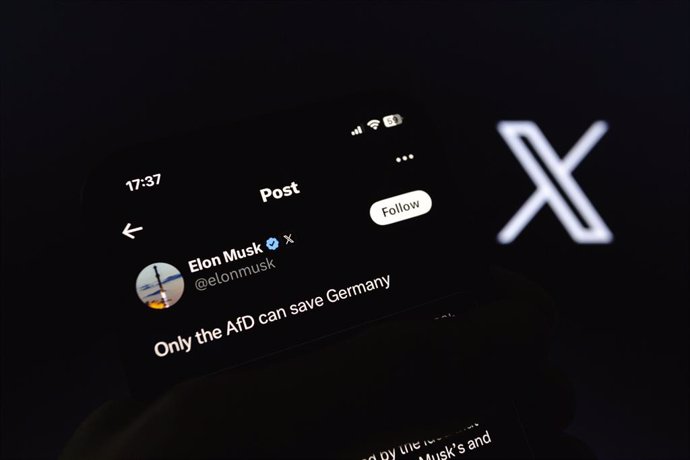 December 20, 2024, Asuncion, Paraguay: Elon Musk's X (formerly Twitter) account is displayed on a smartphone backdropped by X logo. ''Only the AfD can save Germany,'' Elon Musk wrote in a post on his social media platform on Friday.