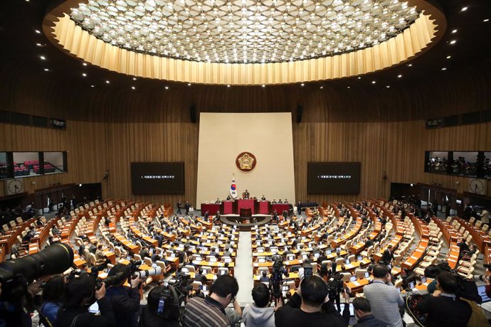 SEOUL, Dec. 14, 2024  -- Lawmakers cast their votes on the impeachment motion against President Yoon Suk-yeol at the National Assembly in Seoul, South Korea, Dec. 14, 2024.   South Korea's parliament voted Saturday to impeach President Yoon Suk-yeol over 