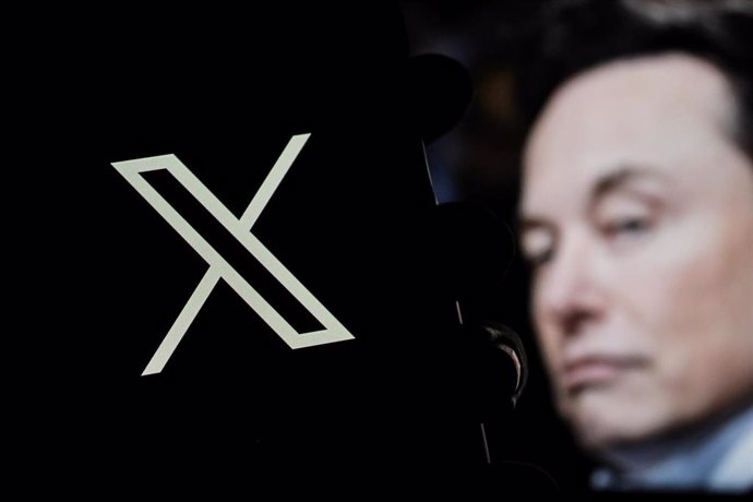 December 20, 2024, Bandung, West Java, Indonesia: In this photo illustration, X logo is displayed on a smartphone with Elon musk profile in the background