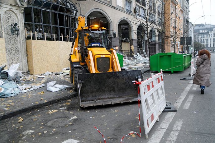 December 23, 2024, Kyiv, Ukraine: KYIV, UKRAINE - DECEMBER 23, 2024 - A bucket loader is used to clean Antonovycha Street in the Holosiivskyi district from the rubble after the Russian missile attack on December 20, Kyiv, capital of Ukraine.