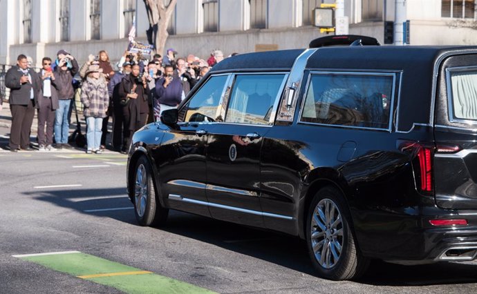 January 4, 2025, Atlanta, Georgia, USA: A hearse carrying the body former President Jimmy Carter makes its departure after a final visit to Georgia Capitol, en route to the Carter Center in Atlanta, where his body will lie in state.  Carter served as the 