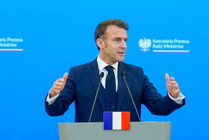 12 December 2024, Poland, Warsaw: French President Emmanuel Macron speaks during a press conference, after his meeting with Polish Prime Minister Donald Tusk. Photo: Marek Antoni Iwanczuk/SOPA Images via ZUMA Press Wire/dpa