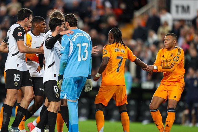 Kylian Mbappe of Real Madrid calms Vinicius Junior during the Spanish league, La Liga EA Sports, football match played between Valencia CF and Real Madrid at Mestalla stadium on January 3, 2025, in Valencia, Spain.