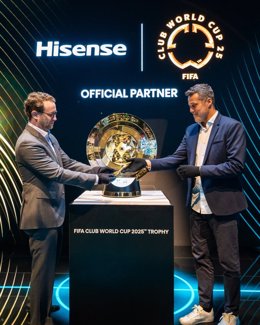 David Gold, Vice President of Hisense International and President of Hisense Americas and Aldo Kafie, Head of FIFA Partnership Management, unveil the FIFA Club World Cup 2025 Trophy at CES