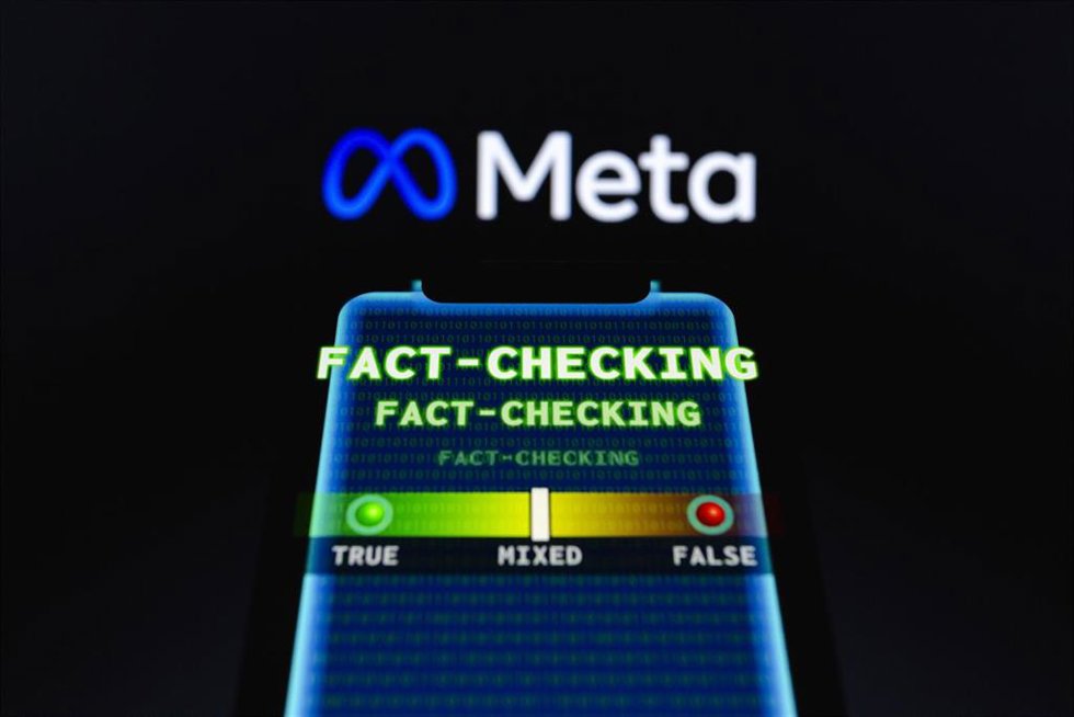 Meta Platforms logo is displayed behind the term "fact-checking" and visual representation of "true false" meter on a smartphone. 