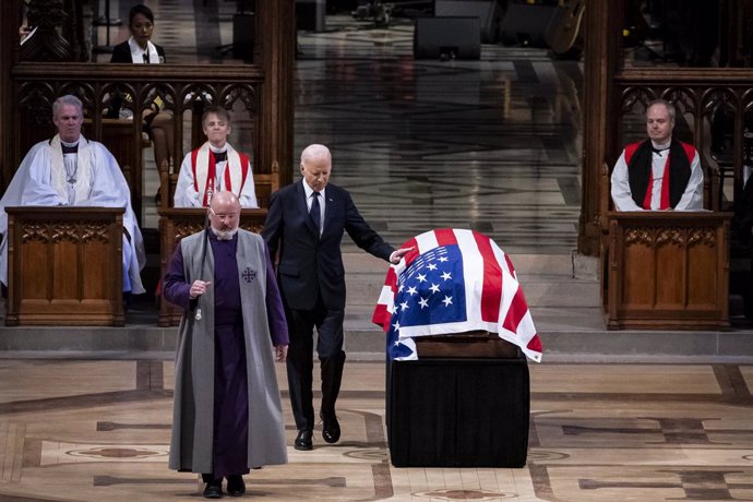 January 9, 2025, Washington, District Of Columbia, USA: DC-CARTER. President Joe Biden touches the casket after delivering remarks at former President Jimmy Carter's funeral at National Cathedral in Washington, D.C. on Thursday, January 9, 2025