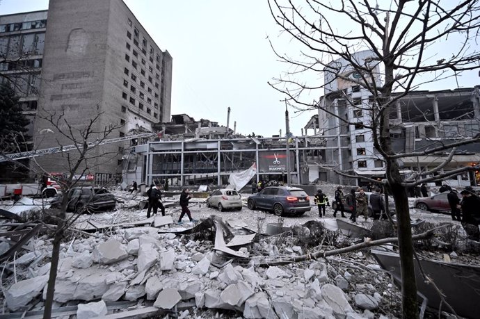 10 December 2024, Ukraine, Zaporizhzhia: People inspect the damaged buildings after a Russian missile strike. Three people are dead and at least 14 people are injured. Photo: -/Ukrinform/dpa