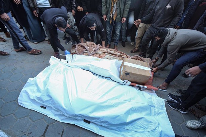 January 9, 2025, Deir Al Balah, Gaza Strip, Palestinian Territory: Palestinians mourn during the funeral of their relatives killed in Israeli air strikes, in Al Aqsa Martyrs Hospital, in Deir Al Balah, central Gaza Strip, 09 January 2025