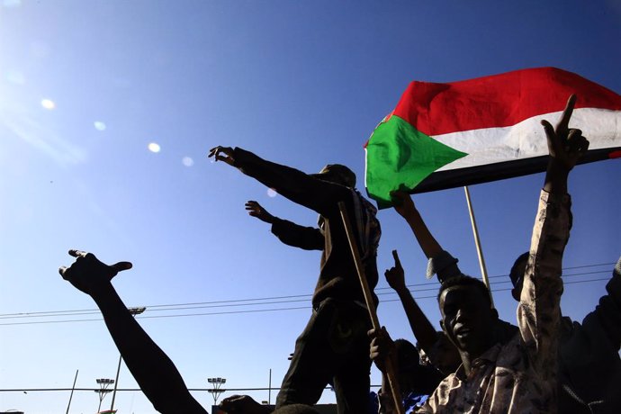 OMDURMAN, Jan. 12, 2025  -- This photo taken on Jan. 11, 2025 shows people celebrating the Sudanese army's retaking of Wad Madani, the capital city of Gezira State in central Sudan, in Omdurman, north of the capital Khartoum, Sudan. The Sudanese Armed For